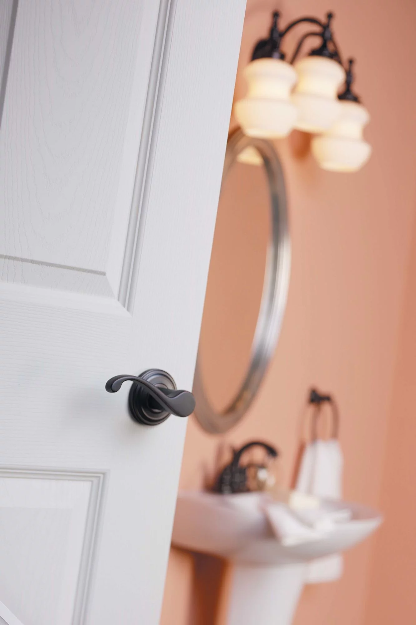 Kwikset Commonwealth Lever Passage in Venetian Bronze